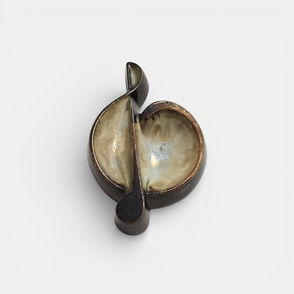 Two-tone brown-and-beige mid-century modern pottery dish marked