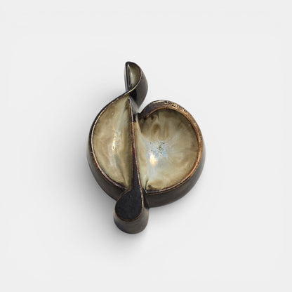 Two-tone brown-and-beige mid-century modern pottery dish marked