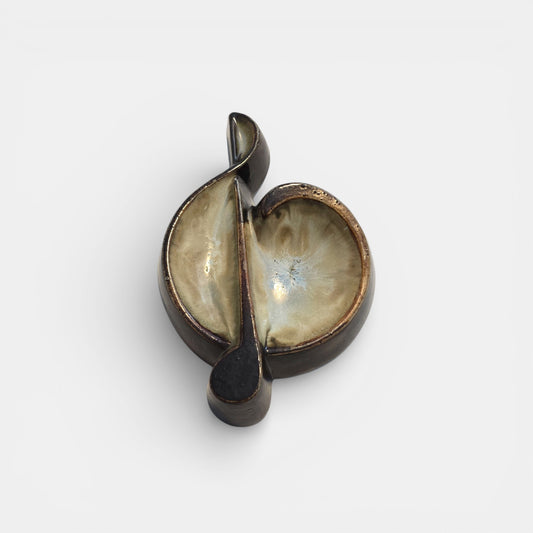 Two-tone brown-and-beige mid-century modern pottery dish marked