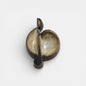 Two-tone brown-and-beige mid-century modern pottery dish marked