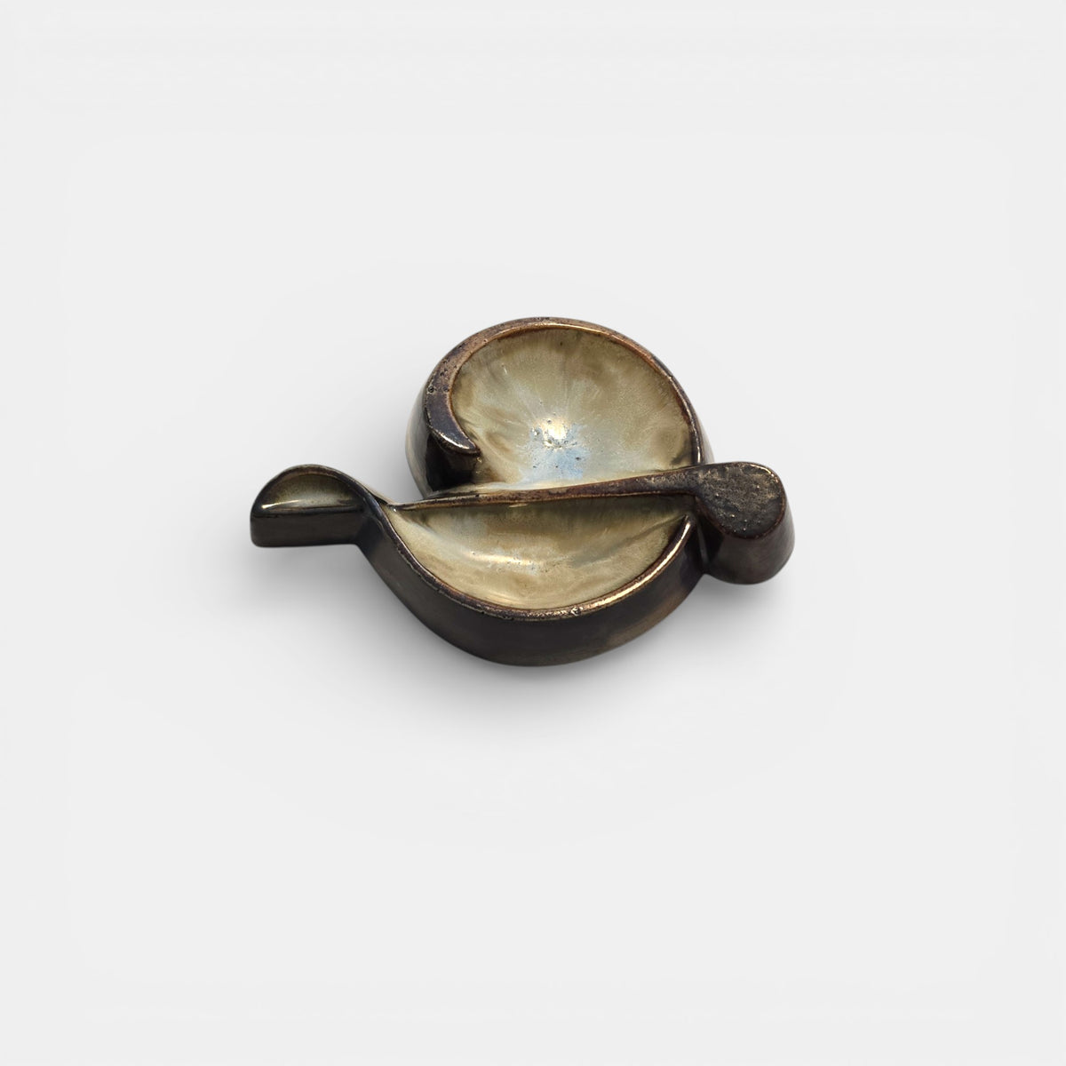 Two-tone brown-and-beige mid-century modern pottery dish marked