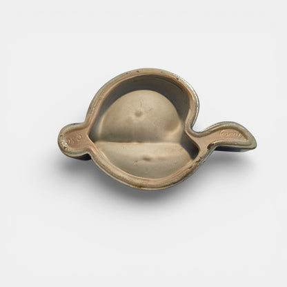 Two-tone brown-and-beige mid-century modern pottery dish marked